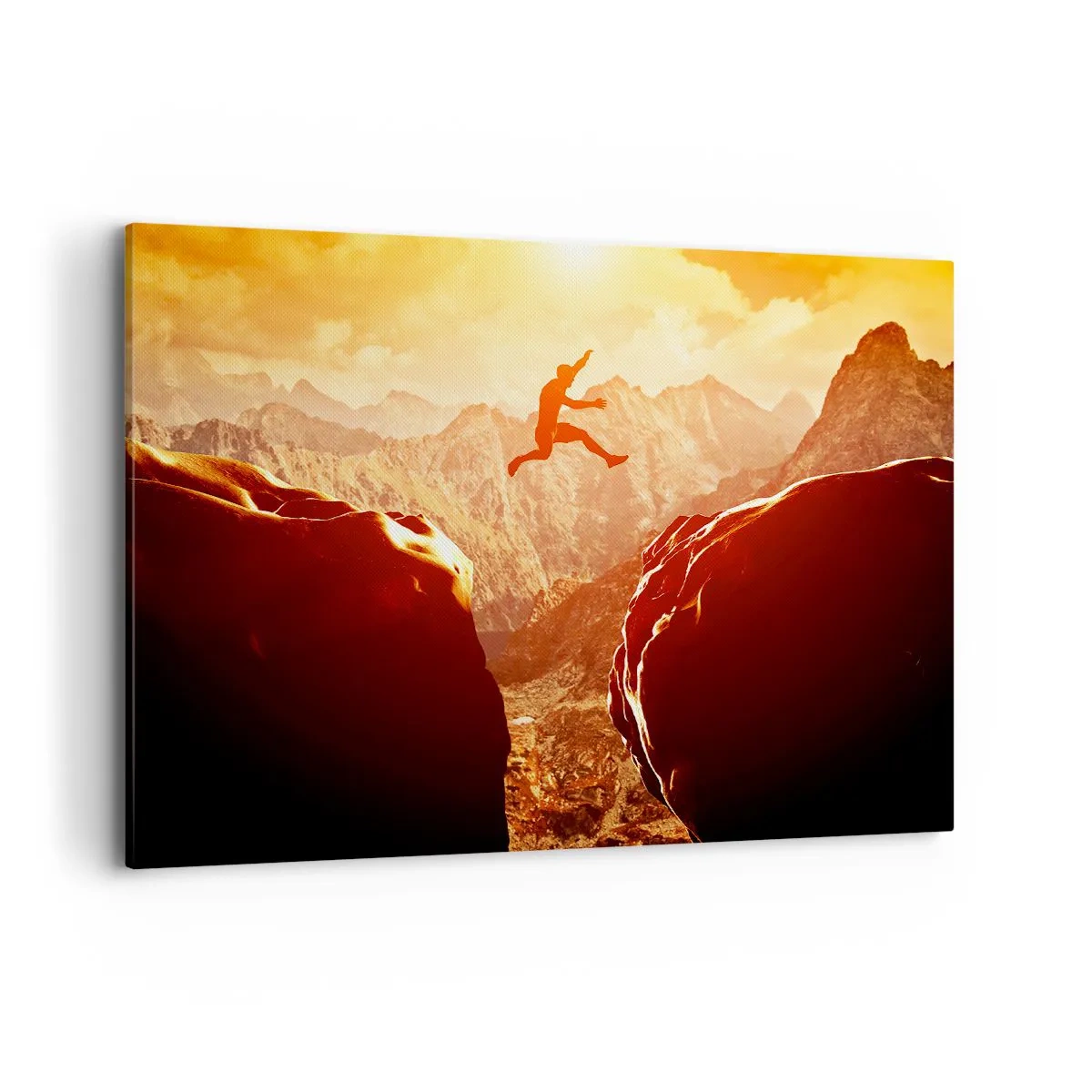 Bild auf Leinwand - Leinwandbild - Eine Figur springt zwischen Felsen mit Bergen im Hintergrund - 100x70cm - Grenzen überschreiten - Moderne Wanddekoration für Wohnzimmer und Schlafzimmer ARTTOR