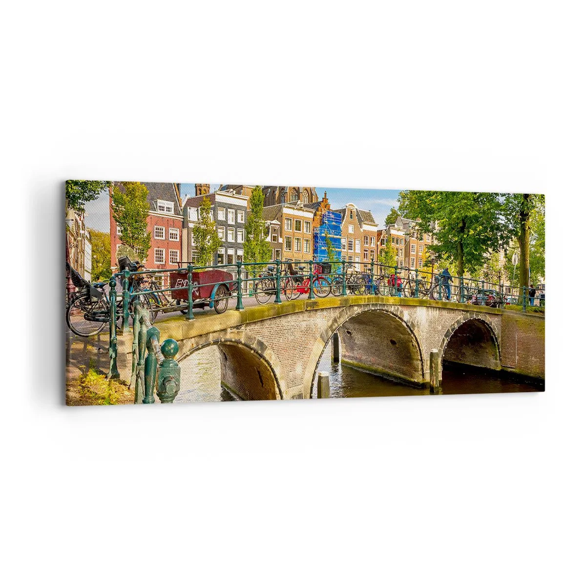 Bild auf Leinwand - Leinwandbild - Ein malerischer Kanal mit einer Brücke in Amsterdam - 120x50cm - Frühling am Kanal - Moderne Wanddekoration für Wohnzimmer und Schlafzimmer ARTTOR