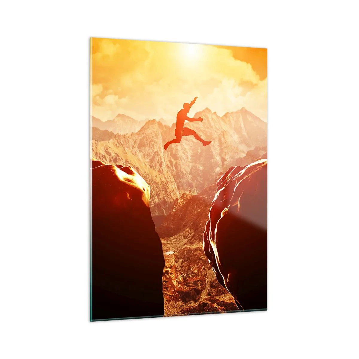 Glasbild - Bild auf glas - Sprung über einen Abgrund in einer Berglandschaft bei Sonnenuntergang - 50x70cm - Grenzen überschreiten - Moderne Wanddekoration für Wohnzimmer und Schlafzimmer ARTTOR