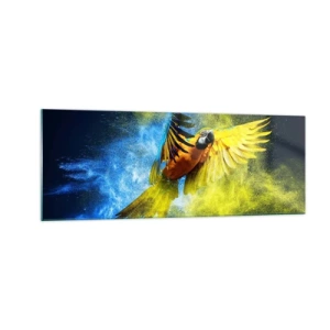 Glasbild - Bild auf glas - Ein Papagei im Flug vor einem Hintergrund aus farbenfrohen Explosionen in Gelb und Blau. - 140x50cm - Im blauen und goldenen Staub - Moderne Wanddekoration für Wohnzimmer und Schlafzimmer ARTTOR