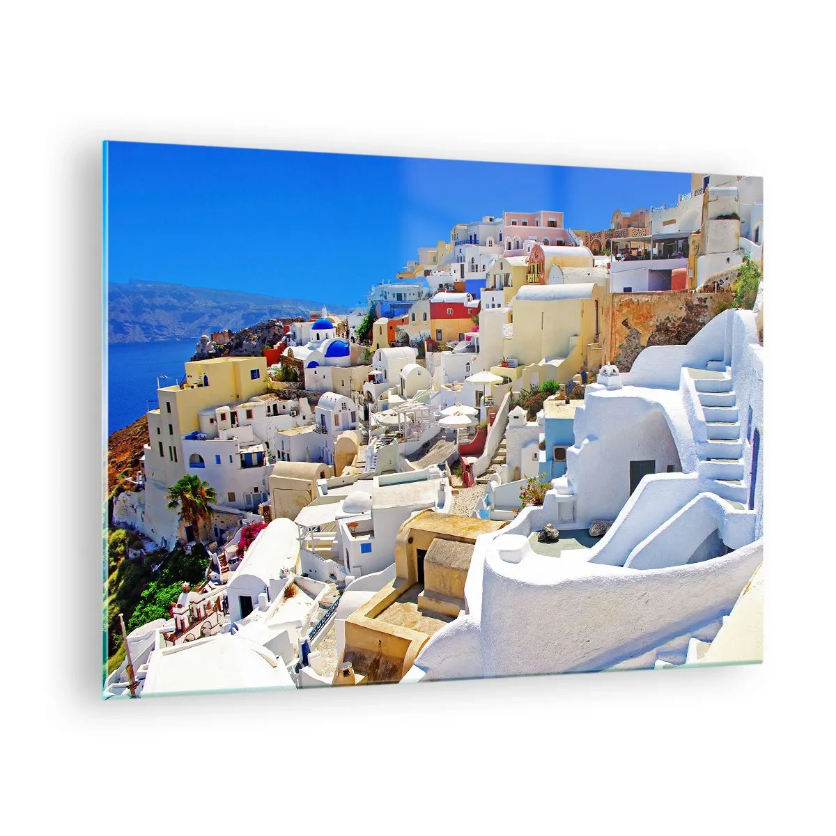Glasbild - Bild auf glas - Santorini mit weißen Häusern vor blauem Himmel - 70x50cm - Der Traum vom griechischen Sommer - Moderne Wanddekoration für Wohnzimmer und Schlafzimmer ARTTOR