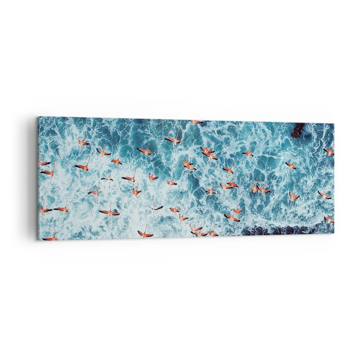 Bild auf Leinwand - Leinwandbild - Eine Vogelperspektive auf rosa Flamingos über einem blauen Ozean - 140x50cm - Die Küstenparade - Moderne Wanddekoration für Wohnzimmer und Schlafzimmer ARTTOR