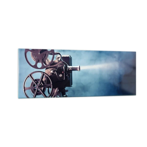 Glasbild - Bild auf glas - Ein alter Filmprojektor wirft Licht vor einen blauen Hintergrund - 140x50cm - Im alten Kino - Moderne Wanddekoration für Wohnzimmer und Schlafzimmer ARTTOR