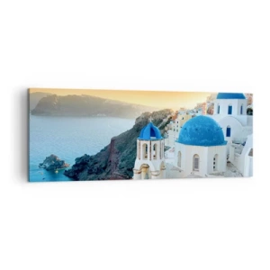 Bild auf Leinwand - Leinwandbild - Blick auf Santorini mit weißen Gebäuden und blauem Meer - 140x50cm - Santorini - an die Felsen gekuschelt - Moderne Wanddekoration für Wohnzimmer und Schlafzimmer ARTTOR