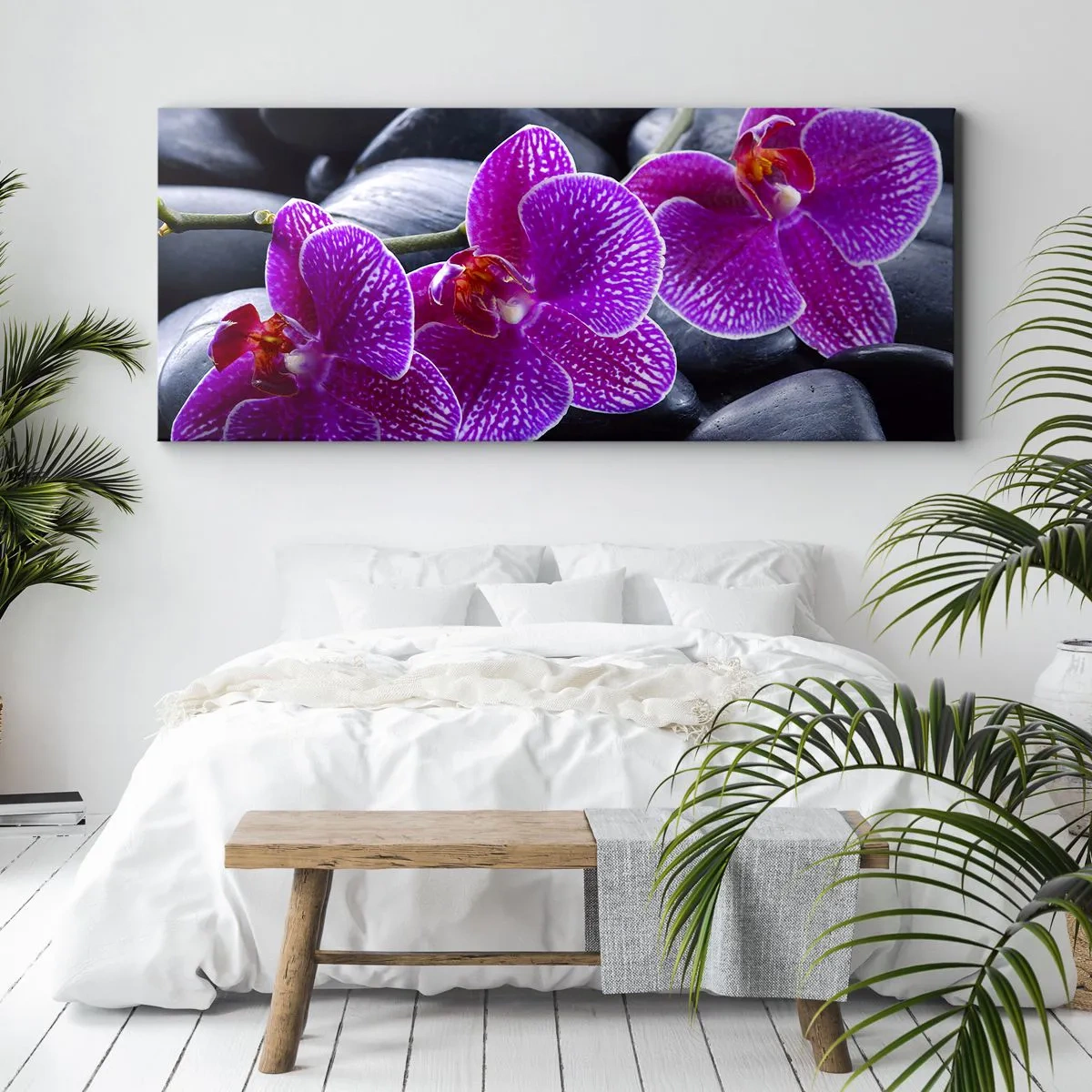 Bild auf Leinwand - Leinwandbild - Lila Orchideen vor einem Hintergrund aus schwarzen Steinen - 120x50cm - Die Steine