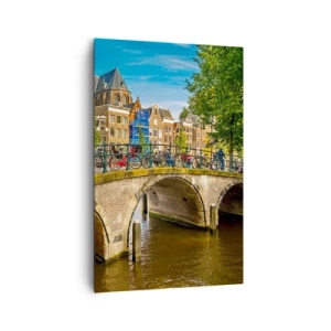 Bild auf Leinwand - Leinwandbild - Ein malerischer Kanal mit einer Brücke in Amsterdam - 80x120cm - Frühling am Kanal - Moderne Wanddekoration für Wohnzimmer und Schlafzimmer ARTTOR