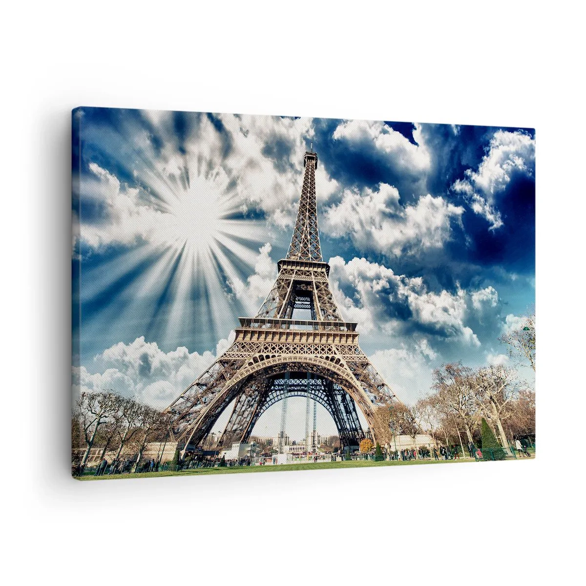 Bild auf Leinwand - Leinwandbild - Der Eiffelturm vor einem sonnigen Himmel mit Wolken - 70x50cm - Die Einzige unter der Sonne - Moderne Wanddekoration für Wohnzimmer und Schlafzimmer ARTTOR