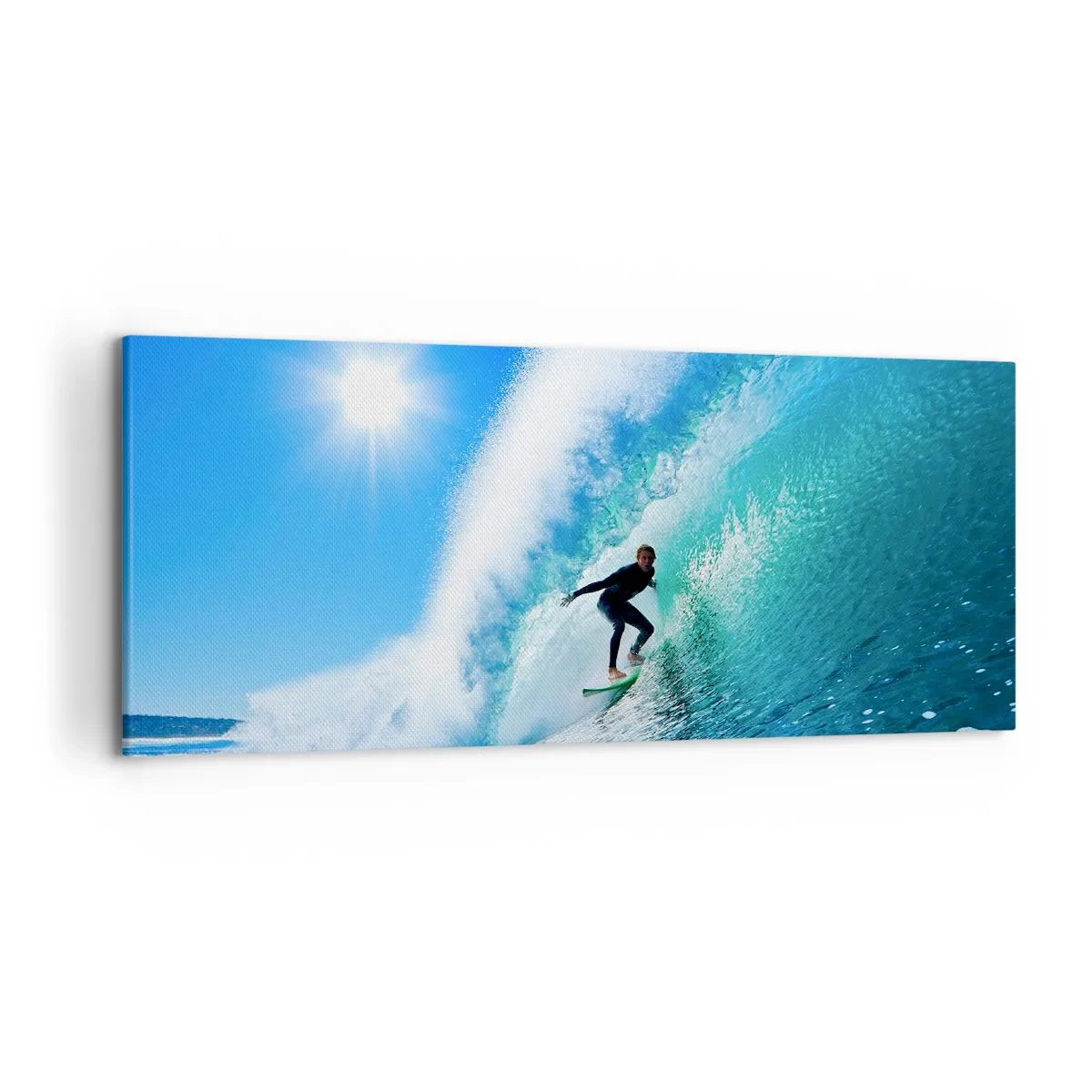 Bild auf Leinwand - Leinwandbild - Ein Surfer auf einem Brett reitet unter blauem Himmel auf einer starken Welle. - 120x50cm - Durch das große Blau - Moderne Wanddekoration für Wohnzimmer und Schlafzimmer ARTTOR