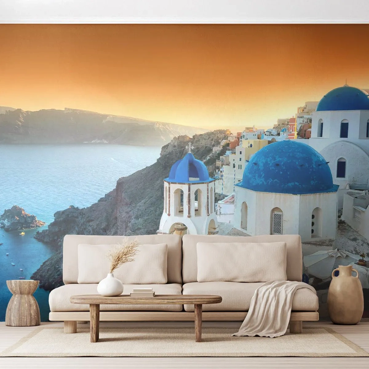 Fototapete Premium Sand - Weiße Gebäude mit blauen Kuppeln auf den Klippen - 100x70cm - Santorini - an die Felsen gekuschelt - Moderne Wanddekoration für Wohnzimmer und Schlafzimmer ARTTOR