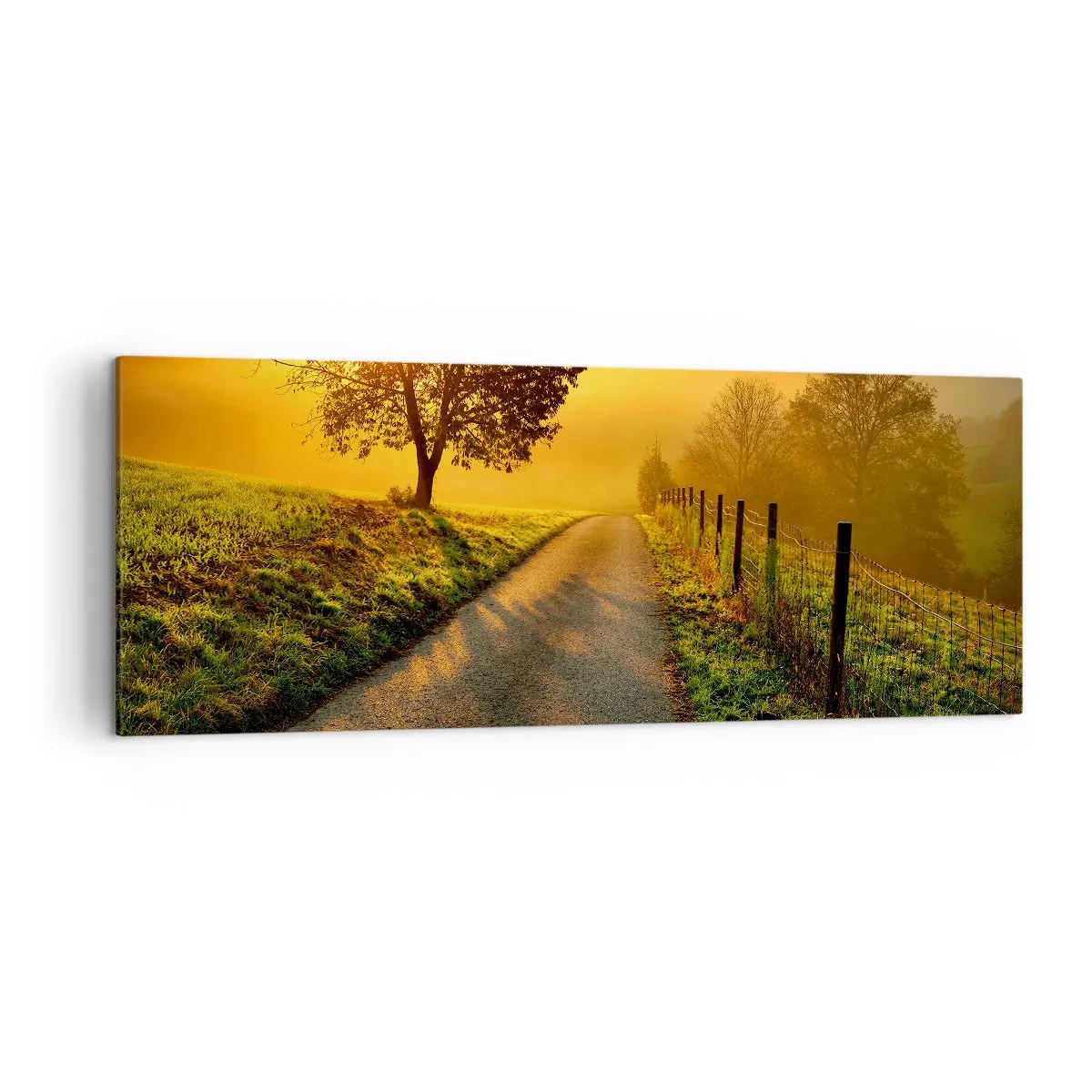 Bild auf Leinwand - Leinwandbild - Eine malerische Straße bei Sonnenuntergang mit einem einsamen Baum im Hintergrund - 140x50cm - Honig-Nachmittag - Moderne Wanddekoration für Wohnzimmer und Schlafzimmer ARTTOR