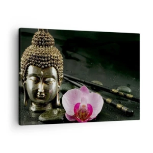 Bild auf Leinwand - Leinwandbild - Eine Buddha-Statuette mit Orchidee und Essstäbchen vor einem Hintergrund aus Steinen - 70x50cm - Harmonie von Weisheit und Schönheit - Moderne Wanddekoration für Wohnzimmer und Schlafzimmer ARTTOR