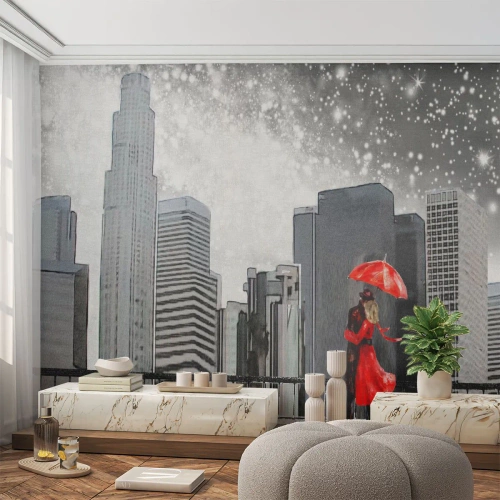 Fototapete Premium Canvas - Ein Paar in Rot mit einem Regenschirm vor dem Hintergrund einer Stadtlandschaft - 100x70cm - Der Mensch ist kein Stein - Moderne Wanddekoration für Wohnzimmer und Schlafzimmer ARTTOR
