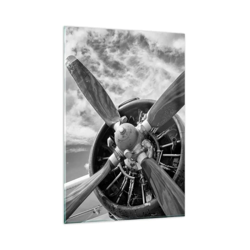 Glasbild - Bild auf glas - Ein Schwarzweißfoto eines Flugzeugpropellers vor einem dynamischen Himmel. - 80x120cm - Eroberer der Lüfte - Moderne Wanddekoration für Wohnzimmer und Schlafzimmer ARTTOR
