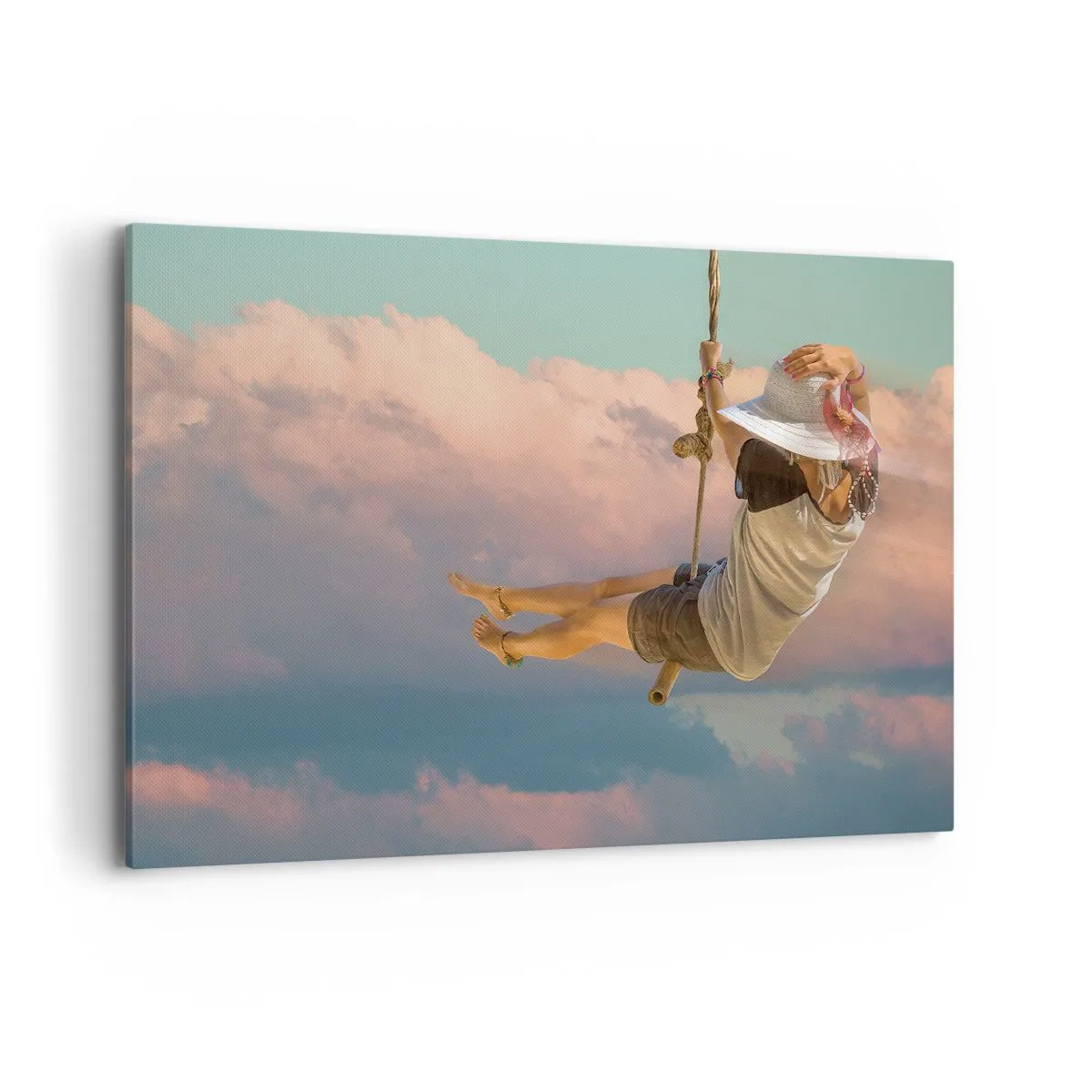 Bild auf Leinwand - Leinwandbild - Frau auf einer Schaukel zwischen rosa Wolken - 100x70cm - Spaß in den Wolken - Moderne Wanddekoration für Wohnzimmer und Schlafzimmer ARTTOR