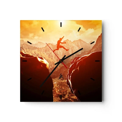 Wanduhr - Glasuhr - Eine Figur springt zwischen Felsen mit Bergen im Hintergrund - 30x30cm - Grenzen überschreiten - Moderne Wanddekoration für Wohnzimmer und Schlafzimmer ARTTOR