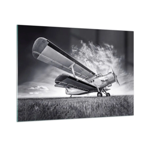 Glasbild - Bild auf glas - Ein Schwarzweißfoto eines Flugzeugs vor einem dramatischen Himmel. - 100x70cm - Der geflügelte Wanderer - Moderne Wanddekoration für Wohnzimmer und Schlafzimmer ARTTOR