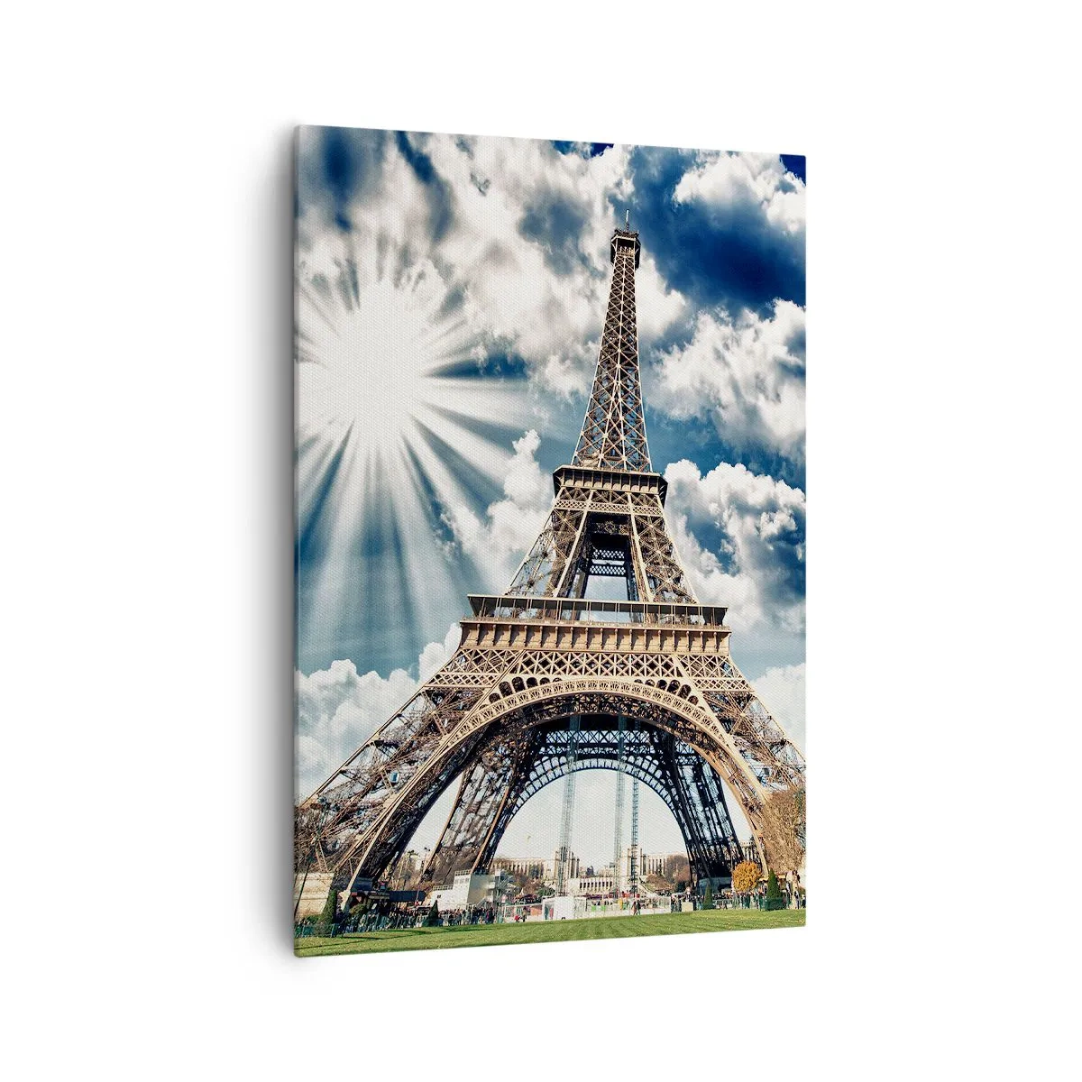 Bild auf Leinwand - Leinwandbild - Der Eiffelturm vor einem sonnigen Himmel mit Wolken - 70x100cm - Die Einzige unter der Sonne - Moderne Wanddekoration für Wohnzimmer und Schlafzimmer ARTTOR