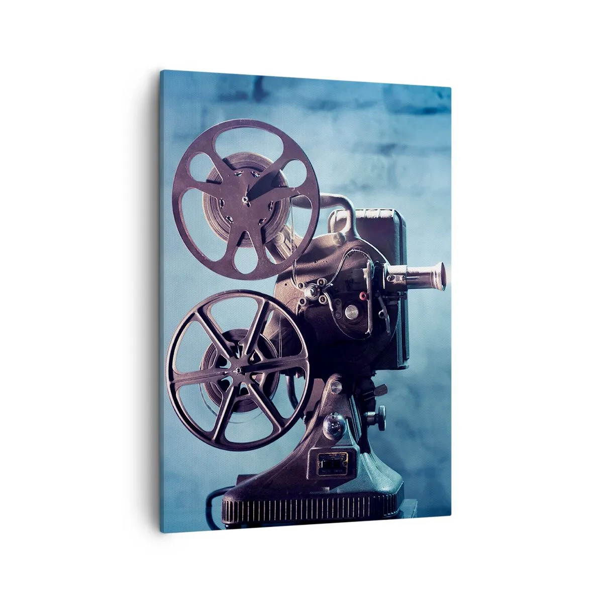 Bild auf Leinwand - Leinwandbild - Ein alter Filmprojektor wirft Licht vor einen blauen Hintergrund - 50x70cm - Im alten Kino - Moderne Wanddekoration für Wohnzimmer und Schlafzimmer ARTTOR