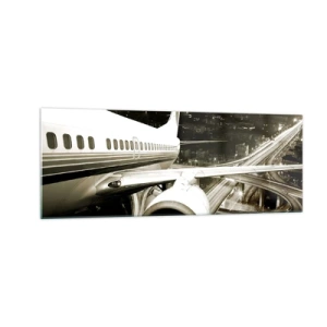 Glasbild - Bild auf glas - Ein Flugzeug über einer nächtlichen Stadt mit beleuchteten Autobahnen - 140x50cm - In die Nacht fliegen - Moderne Wanddekoration für Wohnzimmer und Schlafzimmer ARTTOR