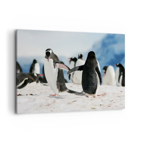 Bild auf Leinwand - Leinwandbild - Eine Gruppe Pinguine im Schnee in einer antarktischen Landschaft - 100x70cm - Tanzen im Schnee - Moderne Wanddekoration für Wohnzimmer und Schlafzimmer ARTTOR