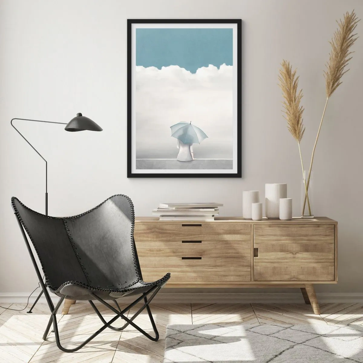 Poster in einem schwarzem Rahmen - Eine Figur mit einem Regenschirm sitzt auf einem Felsvorsprung zwischen den Wolken - 50x70cm - Am Rande der Realität und Träume - Moderne Wanddekoration für Wohnzimmer und Schlafzimmer ARTTOR