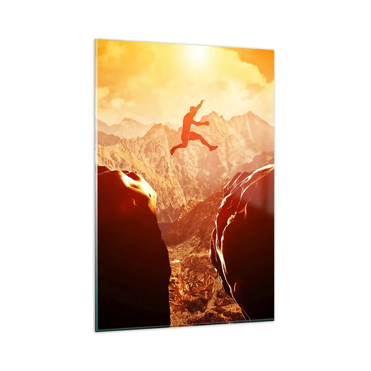 Glasbild - Bild auf glas - Eine Figur springt zwischen Felsen mit Bergen im Hintergrund - 80x120cm - Grenzen überschreiten - Moderne Wanddekoration für Wohnzimmer und Schlafzimmer ARTTOR
