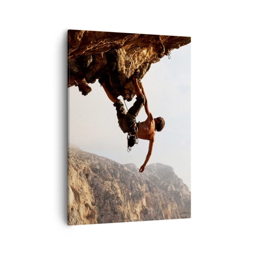 Bild auf Leinwand - Leinwandbild - Ein Kletterer auf einer steilen Klippe in den Bergen im Sonnenschein - 50x70cm - Die Welt ist in einer Hand auf einem Felsblock geschrumpft - Moderne Wanddekoration für Wohnzimmer und Schlafzimmer ARTTOR