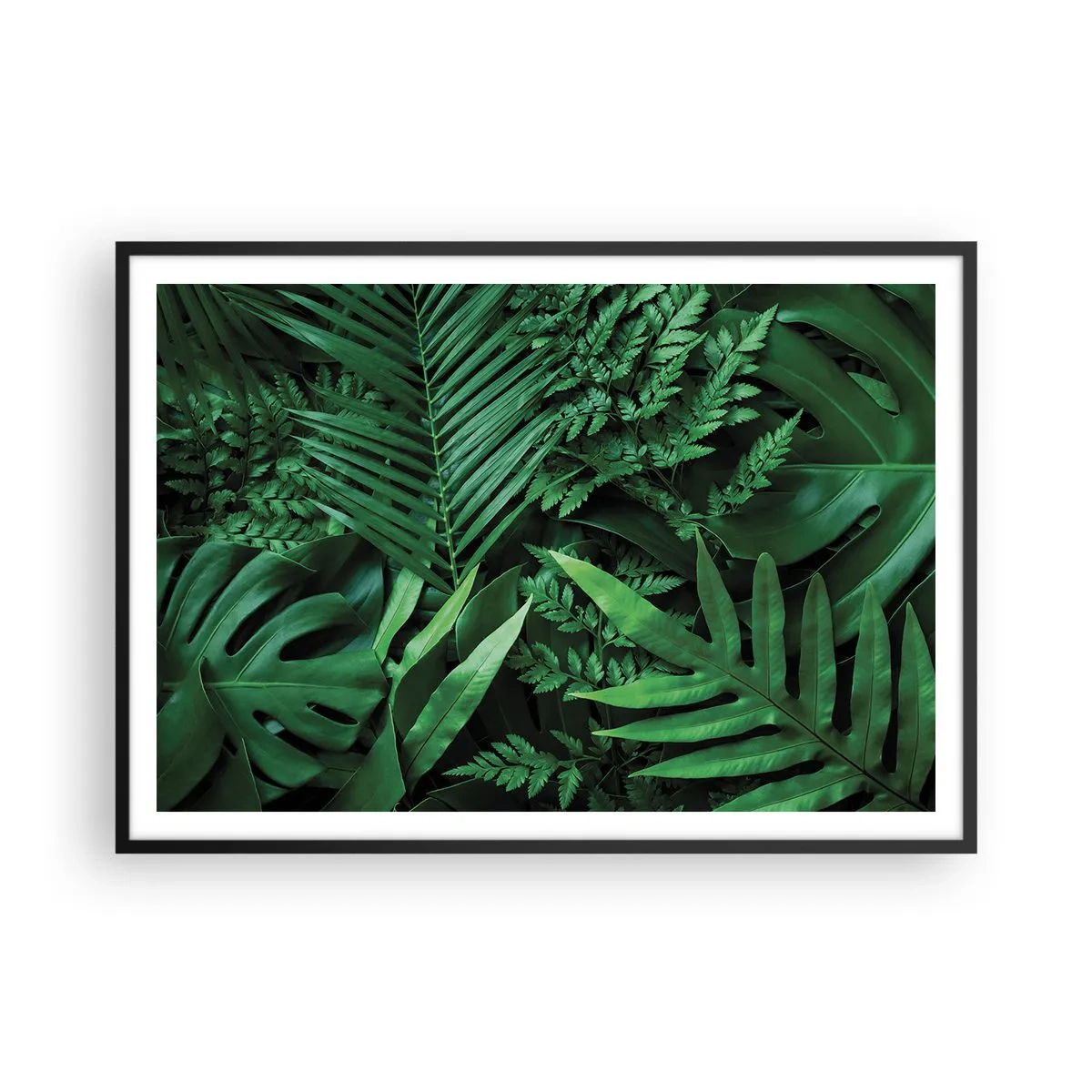 Poster in einem schwarzem Rahmen - Grüne tropische Blätter in einer dichten und natürlichen Komposition - 100x70cm - Eingebettet ins Grüne - Moderne Wanddekoration für Wohnzimmer und Schlafzimmer ARTTOR