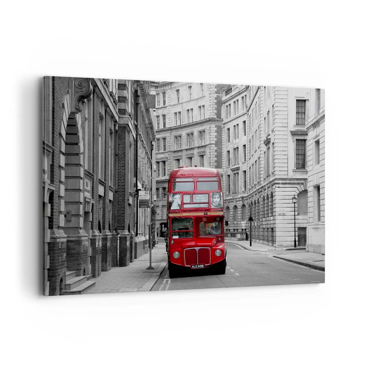 Bild auf Leinwand - Leinwandbild - Ein roter Bus vor einem Hintergrund aus schwarz-weißen Stadtgebäuden. - 100x70cm - Der Alltag muss nicht grau sein - Moderne Wanddekoration für Wohnzimmer und Schlafzimmer ARTTOR