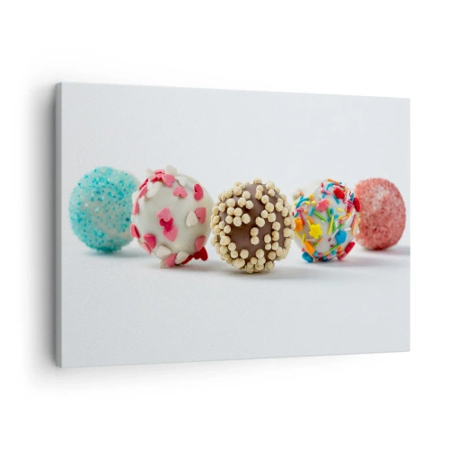 Bild auf Leinwand - Leinwandbild - Bunte Pralinen mit Dekorationen auf weißem Hintergrund - 70x50cm - Das Leben kann süß sein - Moderne Wanddekoration für Wohnzimmer und Schlafzimmer ARTTOR