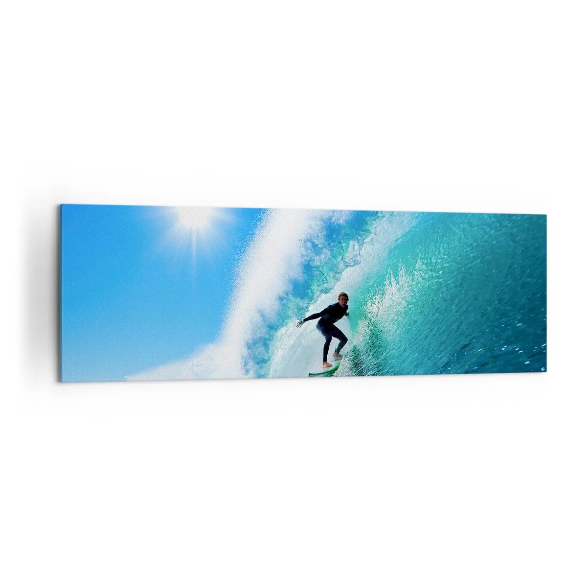 Bild auf Leinwand - Leinwandbild - Ein Surfer auf einem Brett reitet unter blauem Himmel auf einer starken Welle. - 160x50cm - Durch das große Blau - Moderne Wanddekoration für Wohnzimmer und Schlafzimmer ARTTOR