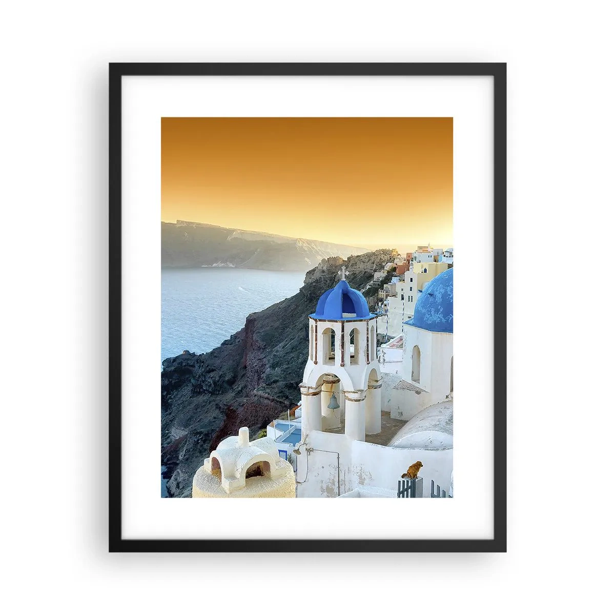 Poster in einem schwarzem Rahmen - Santorini - an die Felsen gekuschelt - 40x50 cm