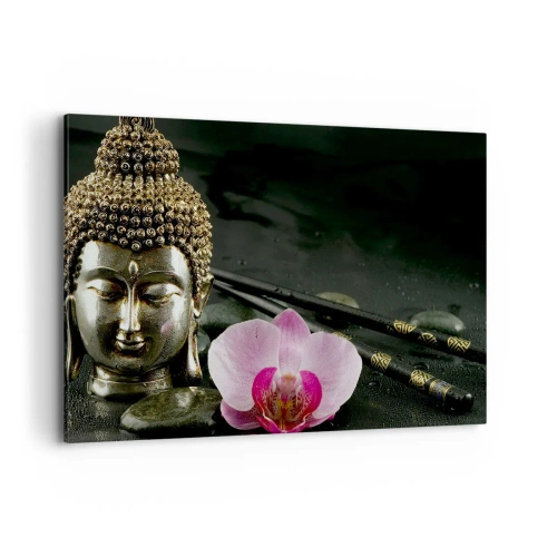 Bild auf Leinwand - Leinwandbild - Eine Buddha-Statuette mit Orchidee und Essstäbchen vor einem Hintergrund aus Steinen - 100x70cm - Harmonie von Weisheit und Schönheit - Moderne Wanddekoration für Wohnzimmer und Schlafzimmer ARTTOR