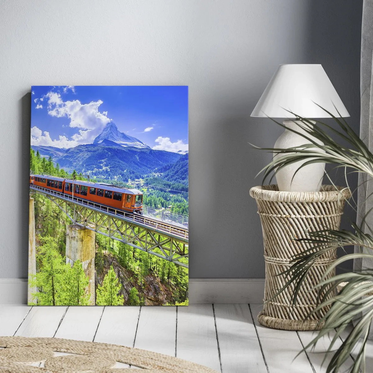 Bild auf Leinwand - Leinwandbild - Eine Achterbahn auf einer Brücke mit Blick auf einen Wasserfall und Berge - 70x100cm - Jetzt sind Alpen dran - Moderne Wanddekoration für Wohnzimmer und Schlafzimmer ARTTOR