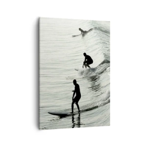 Bild auf Leinwand - Leinwandbild - Surfer auf den Wellen in einer monochromen Aufnahme - 50x70cm - Gegen die Welle - Moderne Wanddekoration für Wohnzimmer und Schlafzimmer ARTTOR