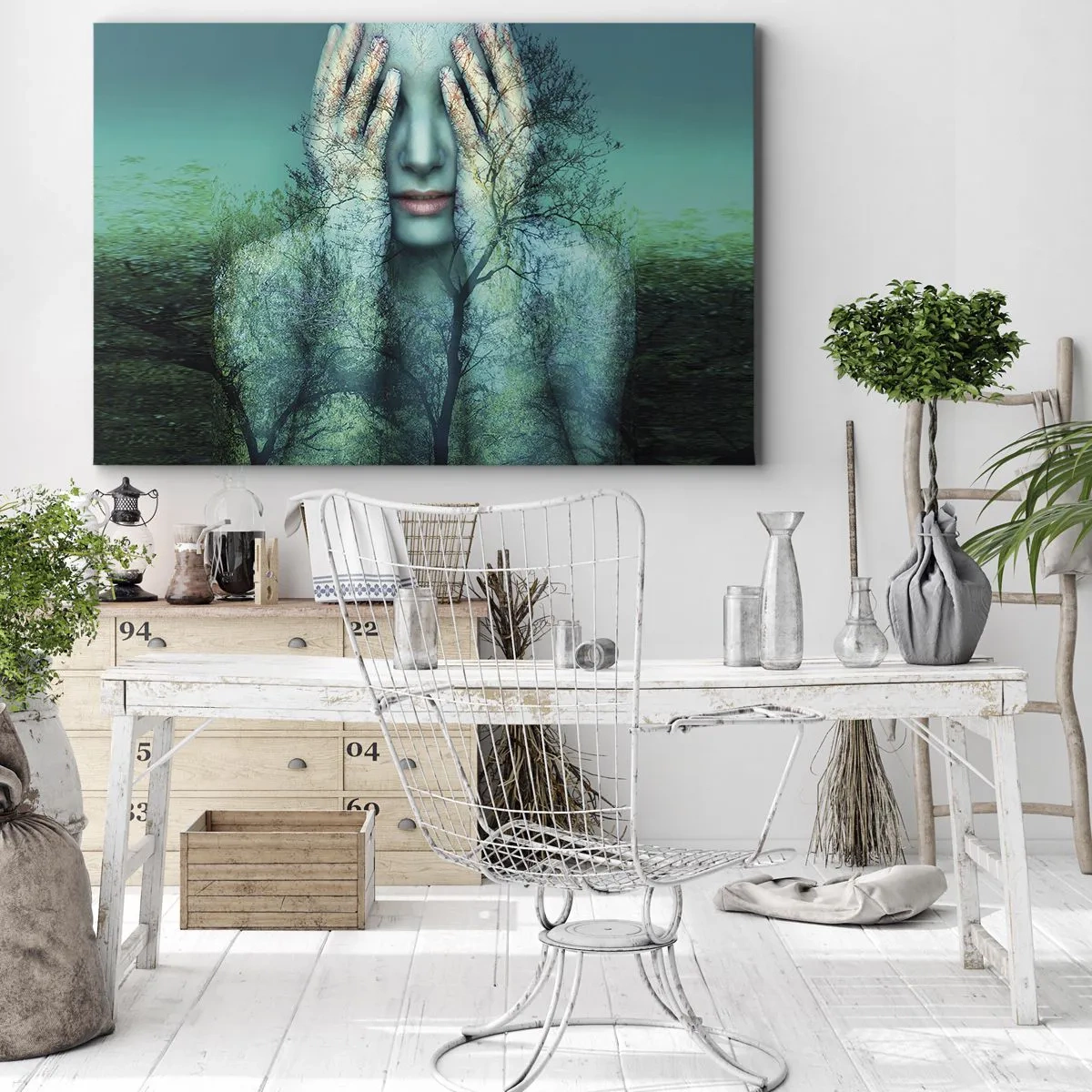 Bild auf Leinwand - Leinwandbild - Eine Frauenfigur mit Baummotiv vor türkisfarbenem Landschaftshintergrund - 70x50cm - Eingetaucht in Blau - Moderne Wanddekoration für Wohnzimmer und Schlafzimmer ARTTOR