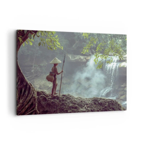 Bild auf Leinwand - Leinwandbild - Eine Figur mit einem Speer an einem Wasserfall in einem tropischen Wald - 100x70cm - Befreundet mit der Natur - Moderne Wanddekoration für Wohnzimmer und Schlafzimmer ARTTOR