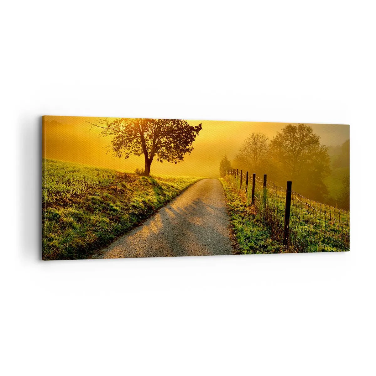 Bild auf Leinwand - Leinwandbild - Eine malerische Straße bei Sonnenuntergang mit einem einsamen Baum im Hintergrund - 120x50cm - Honig-Nachmittag - Moderne Wanddekoration für Wohnzimmer und Schlafzimmer ARTTOR