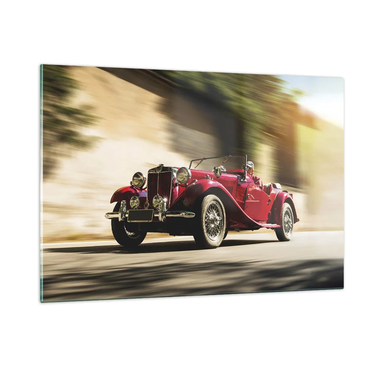 Glasbild - Bild auf glas - Klassisches rotes Cabrio in Bewegung vor dem Hintergrund der Straße und der verschwommenen Landschaft - 120x80cm - Schöner als Nike von Samothrake - Moderne Wanddekoration für Wohnzimmer und Schlafzimmer ARTTOR