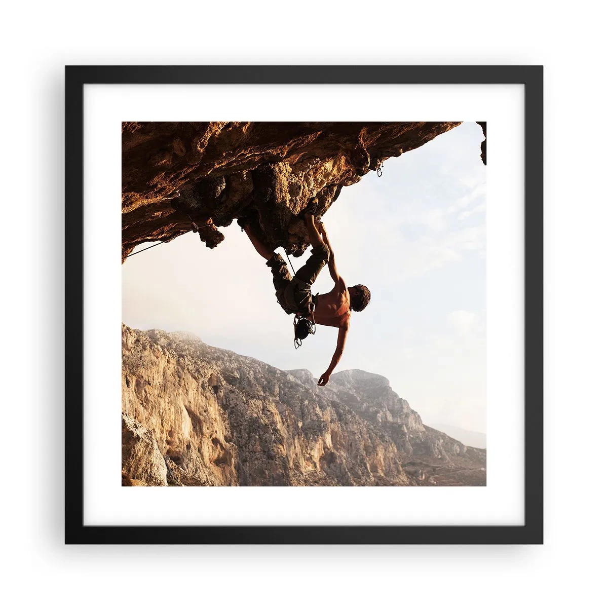 Poster in einem schwarzem Rahmen - Die Welt ist in einer Hand auf einem Felsblock geschrumpft - 40x40 cm