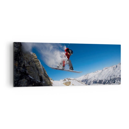 Bild auf Leinwand - Leinwandbild - Ein Snowboarder springt von einem Felsen vor einer Berglandschaft - 140x50cm - Und du wurdest Teil des Raums - Moderne Wanddekoration für Wohnzimmer und Schlafzimmer ARTTOR