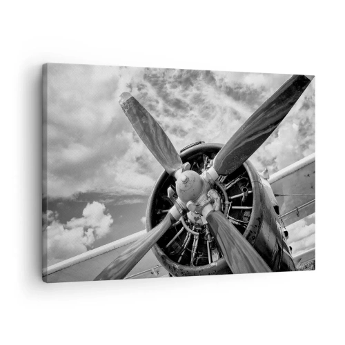 Bild auf Leinwand - Leinwandbild - Ein Schwarzweißfoto eines Flugzeugpropellers vor einem dynamischen Himmel. - 70x50cm - Eroberer der Lüfte - Moderne Wanddekoration für Wohnzimmer und Schlafzimmer ARTTOR