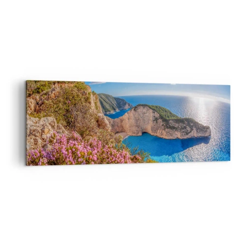 Bild auf Leinwand - Leinwandbild - Eine Klippe mit Blumen, ein türkisfarbenes Meer und eine sonnige griechische Landschaft - 140x50cm - Mein toller Griechenlandurlaub - Moderne Wanddekoration für Wohnzimmer und Schlafzimmer ARTTOR