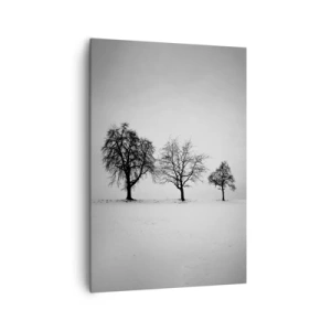 Bild auf Leinwand - Leinwandbild - Drei Bäume auf einem schneebedeckten Feld im monochromen Stil - 70x100cm - Wovon träumen sie? - Moderne Wanddekoration für Wohnzimmer und Schlafzimmer ARTTOR