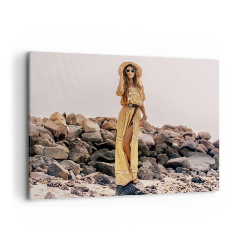 Bild auf Leinwand - Leinwandbild - Eine Frau im Boho-Stil vor einem felsigen Strandhintergrund - 100x70cm - Die Magie der Steine - Moderne Wanddekoration für Wohnzimmer und Schlafzimmer ARTTOR