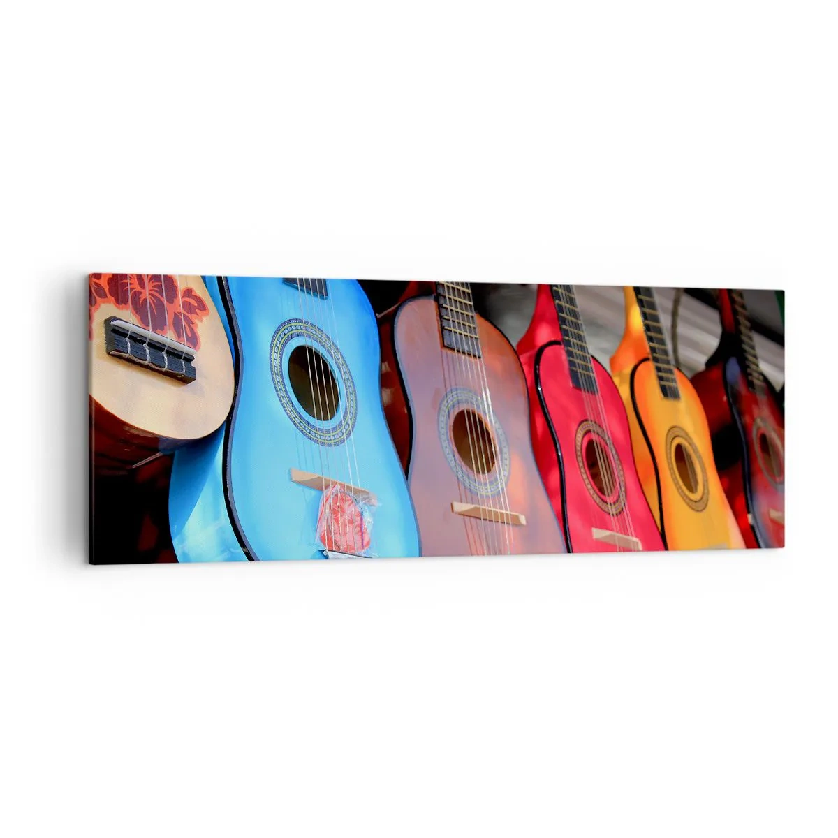 Bild auf Leinwand - Leinwandbild - Bunte Akustikgitarren hängen in einer Reihe auf dem Display - 140x50cm - Lateinische Atmosphäre - Moderne Wanddekoration für Wohnzimmer und Schlafzimmer ARTTOR