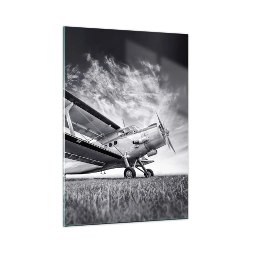 Glasbild - Bild auf glas - Ein Schwarzweißfoto eines Flugzeugs vor einem dramatischen Himmel. - 50x70cm - Der geflügelte Wanderer - Moderne Wanddekoration für Wohnzimmer und Schlafzimmer ARTTOR