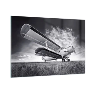 Glasbild - Bild auf glas - Ein Schwarzweißfoto eines Flugzeugs vor einem dramatischen Himmel. - 100x70cm - Der geflügelte Wanderer - Moderne Wanddekoration für Wohnzimmer und Schlafzimmer ARTTOR