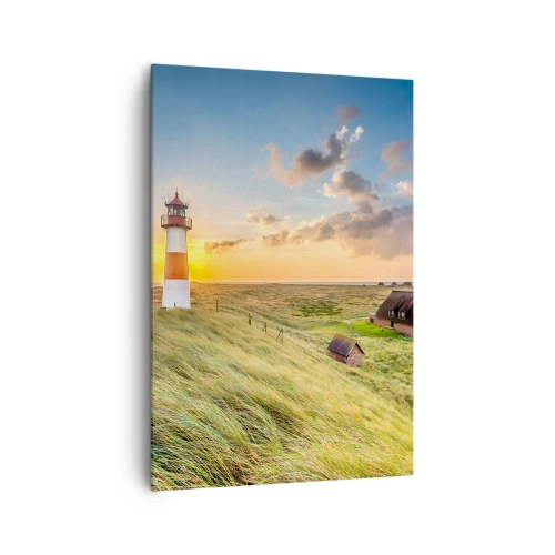 Bild auf Leinwand - Leinwandbild - Ein Leuchtturm mit Wiesen und Häusern in der Sonne im Hintergrund - 70x100cm - Zwischen den Wellen - Moderne Wanddekoration für Wohnzimmer und Schlafzimmer ARTTOR