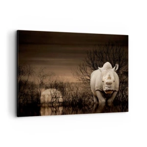 Bild auf Leinwand - Leinwandbild - Nashorn zwischen Bäumen bei Sonnenuntergang, wilde Natur. - 100x70cm - Weiß gegen die Natur - Moderne Wanddekoration für Wohnzimmer und Schlafzimmer ARTTOR